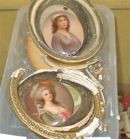 2 oval painted porcelain plaques, frames damaged